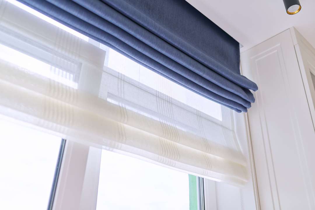 Roman blinds mounted on window